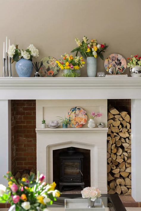 Spring mantel decor ideas: 10 ways to add seasonal style | Homes & Gardens | Spring Mantel Decor, Spring Mantel Decorating Ideas, Spring Mantel, Mantel Decor Ideas, Mantel Design, Mantel Mirrors, Yellow Room, Coastal Living Rooms, Colored Glassware