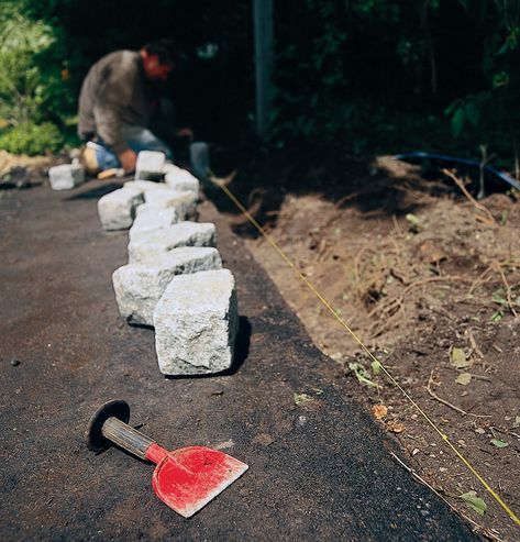 A Better Driveway Border - This Old House Belgian Block Driveway, Gravel Driveway Edging, Driveway Apron, Driveway Border, Belgian Block, Driveway Edging, Bag Of Cement, Stone Driveway, Driveway Landscaping