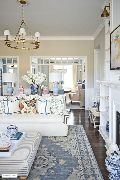 COLORFUL LIVING ROOM DECOR FOR SPRING - CITRINELIVING Light Blue White And Gold Living Room, Clean And Colorful Living Room, Blue Living Room Decor Ideas Inspiration, Costal Inspired Living Rooms, Charleston Style Living Room, Light Blue Gold Living Room, Preppy Colorful Living Room, Preppy Lounge Room, New House Living Room Ideas