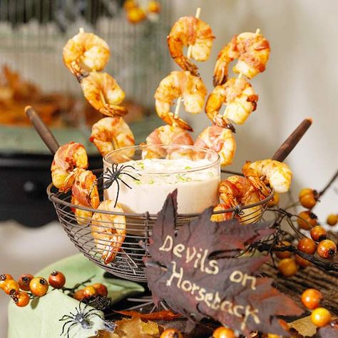 Let’s face it: we’re never too old for Halloween. Create an amazing array of food that is super clever and creepy. Plus, decorate your home in gorgeous and ghoulish style for the occasion. Your Halloween party is sure to be a hit! Bbq Seafood Recipes, Halloween Dinner Party Menu, Devils On Horseback, Halloween Appetizers Easy, Creepy Halloween Food, Halloween Chic, Bbq Seafood, Halloween Party Appetizers, Bacon Wrapped Shrimp