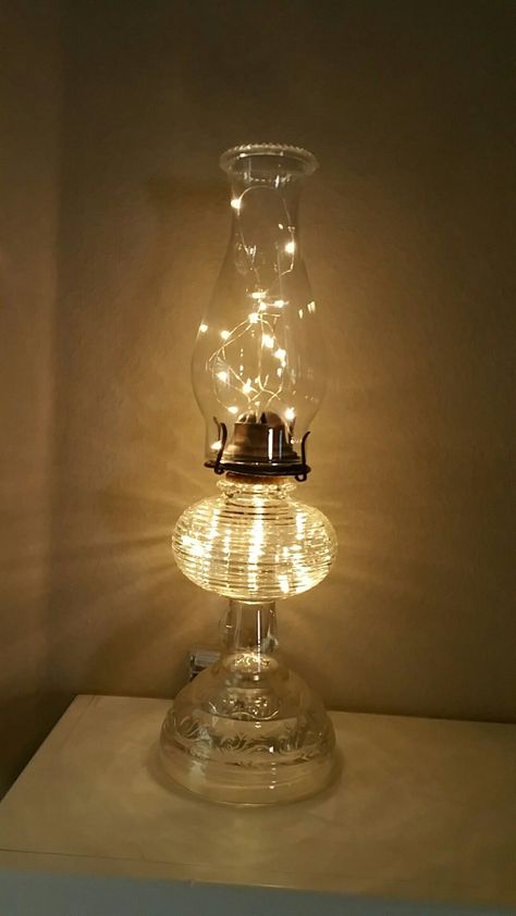 Oil Lamp With Fairy Lights, Oil Lamps Decorations, Oil Lamp Repurposed, Repurposed Oil Lamps, Antique Lanterns Decor Ideas, Oil Lamp Christmas Decor, Oil Lantern Decor Ideas, Vintage Oil Lamp Decor Ideas, Old Lamps Repurposed