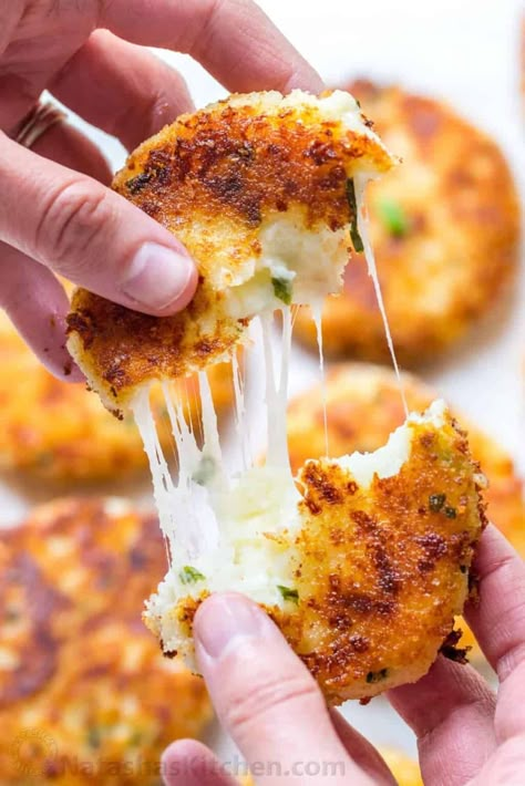 Cheesy mashed potato pancakes recipe - best way to use up leftover mashed potatoes! Mashed Potato Pancakes are crispy outside and loaded with melty cheese! | natashaskitchen.com Claim Jumper Potato Cakes, Cheesy Stuffed Potato Cakes, Cheesy Potato Cakes, Green Chili Cheese Potato Cakes, Cheesy Beef Stuffed Potato Cakes, Cheese Stuffed Potato Cakes, Idaho Potato Recipes, Stuffed Potato Cakes, Fried Potato Cakes