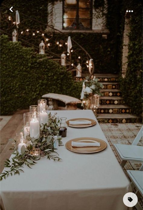 Candlelit Wedding Centerpieces, Sweetheart Table With Greenery Garland, Greens And Candles Centerpieces, Candle Lite Wedding Ceremony, Outdoor Wedding Table Ideas, Clear Charger Plates Wedding, Greenery And Candle Centerpiece, Wedding Head Table Candles, Candle And Greenery Centerpiece