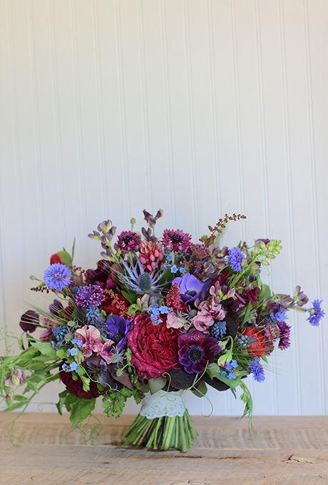 bouquet of anemones, garden roses, sweet peas, bachelor buttons, thistles, lupines, baptisia, green wheat, astilbes, muscari, peonies, ferns, and mint Wedding Flowers Bright, Jewel Tone Wedding Flowers, Large Wedding Bouquet, Beautiful Wedding Bouquets, Green Wheat, Purple Bouquets, Blue Vibes, Bachelor Buttons, Jewel Tone Wedding