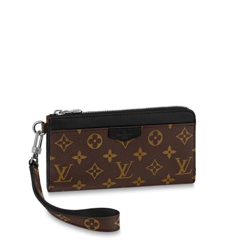 The zippy dragonne wallet is fashioned from monogram canvas with black leather trim, the browns and blacks evoking macassar ebony wood. The main compartment is divided in two and is big enough to hold multiple phones. The dragonne can be hand-carried with its detachable wristband or slipped into a bag. Lv Double Zip Pochette, Louis Vuitton Chain Wallet, Louis Vuitton Pumps, Louis Vuitton Wallet On Chain, Louis Vuitton Zip Wallet, Louis Vuitton Luggage, Louis Vuitton Pochette Metis, Louis Vuitton Wallet Zippy, Louis Vuitton Official Website