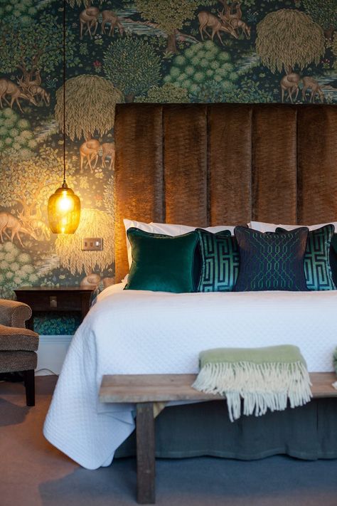 Jewel tones are perfect if you are looking to create a cosy, sumptuous space in which to feel pampered. This wonderful Brook Wallpaper by William Morris provides you with the ideal colour pallet. Here's the ultimate stylish cosy bedrooms to copy https://www.fabricsandpapers.com/cosy-bedroom-ideas-to-copy #Bedroom #MyRoom #ForHim #Green Green Wallpaper Bedroom Feature Wall, Warm Bedroom Wallpaper, Indian Theme Bedroom Ideas, Green Bedroom Wallpaper Ideas, 1930s Bedroom Ideas, William Morris Interior, Jewel Tone Bedroom, Pattern Headboard, Wallpaper Bedroom Feature Wall