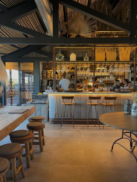 Indulging in coastal delights at this sublime beach restaurant in Comporta. The woody, simple, and modern interior design sets the perfect ambiance for a memorable dining experience. �🏖️✨ Coastal Restaurant Design, Rustic Restaurant Interior Design, Surf Cowboy, Rustic Restaurant Interior, Coastal Restaurant, Coastal Cafe, Beach Restaurant Design, Beachside Restaurant, Boho Farmhouse Kitchen