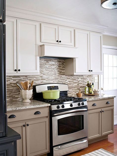 Take painting cabinets to the next level by using contrasting colors. Here, a creamy taupe on the lower cabinets grounds the kitchen, while a lighter, warm white on the uppers keeps the look airy. Kitchen Taupe, Taupe Kitchen Cabinets, Taupe Kitchen, Kitchen Colours, Two Tone Kitchen Cabinets, Kitchen Colour, Refacing Kitchen Cabinets, Two Tone Kitchen, Kitchen Walls