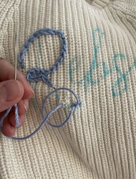 How To DIY a Hand Embroidered Name Sweater • Emily Rone Home How To Embroider A Beanie By Hand, Chunky Name Sweater Diy, How To Embroider Chunky Sweater, Hand Embroider Name On Shirt Diy, How To Hand Stitch Name On Sweater, Diy Hand Embroidered Sweater, Yarn Writing On Sweater, How To Embroider A Name, Chain Stitch Name Sweater