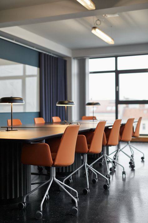 Orange Conference Room, Dark Floor Office, Blue Conference Room, Corporate Conference Room, Office With Orange Accents, Office Interior Design Blue, Office Dark Floor, Blue And Orange Office Design, Orange And Blue Office