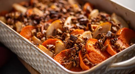 For Sweet Potato lovers everywhere! In this updated take on the classic sweet potato casserole, sliced pears are layered in for delicious sweet flavor, enhanced by a buttery maple glaze. It’s baked with a fun topping of chopped pecans and crumbled gingersnaps for crunchy texture—no marshmallows needed! #sweetpotatocasserole Maple Glazed Sweet Potatoes, Apple Sweet Potato, Side Dish For Thanksgiving, Sweet Potato Bake, Glazed Sweet Potatoes, Sweet Potato Recipes Casserole, Potato Bake, Sliced Pears, Sweet Potato And Apple