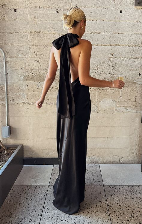 Whether you're walking down the aisle as a bridesmaid or turning heads as a guest, the Lisa Maxi Dress is your go-to for all the events this season. With its chic halter neckline, fluttery scarf tie, and dreamy mermaid cut, it hugs your curves to create a stunning hourglass silhouette. You’ll look enchanting from every angle! Black Bridesmaid Dresses Elegant, Mismatched Bridesmaid Dresses Black, Black Mismatched Bridesmaid Dresses, Rehearsal Dinner Dress For Guest, Black Bridesmaid Dresses Mismatched, Black Tie Bridesmaid Dresses, Bridesmaids Dresses Black, Black Satin Bridesmaid Dress, Moh Dress