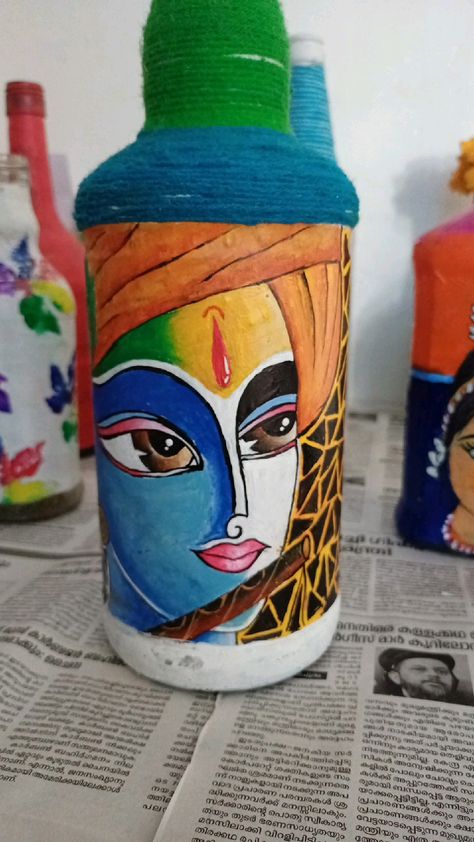 Modern art {krishna} Bottle art Krishna Bottle Painting, Krishna Painting On Bottle, Krishna Bottle Art, Haldi Plate, Glass Bottle Diy Projects, Beer Bottle Art, Bottle Art Projects, Art Krishna, Paint Keys