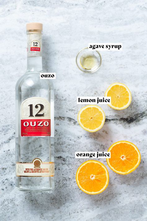 Refreshing and tart, this Citrus Ouzo Cocktail is the perfect summer drink to cool off on a sunny day. With its bright citrus flavor and subtle aniseed aroma, this ouzo-based cocktail is a summer must-have. Made with Greek Ouzo and freshly squeezed juice. Serve it with a sprig of mint and a slice of lemon for added zing! Ouzo Cocktail, Ouzo Drinks, Ouzo Cocktails, Perfect Summer Drink, Fresh Squeezed Juice, Ouzo, Mint Sprig, Agave Syrup, Greek Food