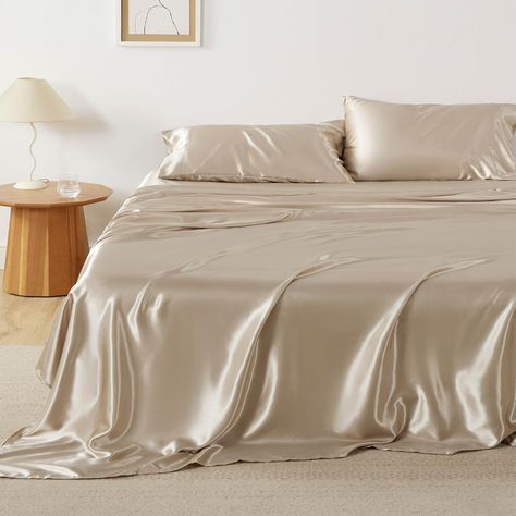 PRICES MAY VARY. Silky Texture: Designed to mimick the lavish feel of silk, these silky sheets offer exceptional softness, a buttery-smooth touch, and refined elegance. This satin sheet is Standard 100 by OEKO-TEX certified for meeting the highest testing criteria for harmful chemicals. Skin and Hair-Friendly: The silky texture of satin is easy on your hair and skin, preventing tugging and irritation throughout the night. Multiple Colors: Bedsure satin sheet set brings an effortlessly chic style Beige Silk Bed Sheets, Silk Sheets And Pillow Cases, Gold Silk Bedding, Elegant Bed Sheets, Satin Sheets Bedrooms, Satin Bed Sheets Aesthetic, Silk Sheets Aesthetic, Silk Bed Sheets Aesthetic, Silky Bed Sheets