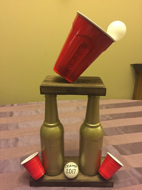 Beer pong trophy that I made for my White Trash Birthday Bash Beer Pong Trophy Diy, Drunk Olympics Games, White Trash Party Games, Beer Olympics Trophy, Diy Trophy Ideas, Drunk Olympics, Beer Pong Trophy, Beer Olympics Party, Beer Pong Party