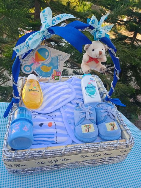 It's a boy themed gift hamper ideas Newborn Hamper Ideas, Newborn Baby Gift Hamper, Baby Boy Gifts Basket, Gift Basket For Baby Boy, Baby Hamper Ideas Baskets, Baby Boy Gift Ideas Newborn, Baby Boy Gift Wrapping Ideas, Baby Boy Hamper Ideas, Baby Hampers Ideas Gift