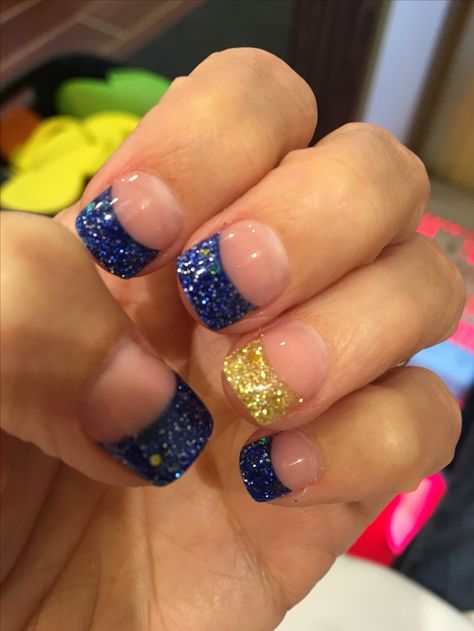 #wvu #nails #gold&blue #glitternails #wvunaildesign Nails With Blue And Gold, Gold And Blue Nails Acrylic, Blue And Gold Ombre Nails, Michigan Nails Wolverines, Blue And Gold French Tip Nails, Wvu Nails, Ffa Nails, Birthday Nails Blue, Panther Nails