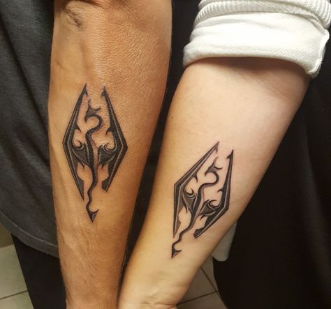 Skyrim Matching Tattoos, Skyrim Logo Tattoo, Matching Lotr Tattoo, Small Skyrim Tattoo, Matching Tattoos Father And Daughter, Paarthurnax Skyrim Tattoo, Oblivion Tattoo, Matching Tattoos Dad Daughter, Skyrim Tattoo Ideas