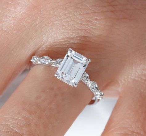 Emerald Cut Moissanite Engagement Ring, 1.90 CT Emerald Cut Engagement Ring, Emerald Cut Solitaire Ring , Promise Ring, Anniversary Ring  CENTER STONE  →Type : moissanite →Shape: Emerald → Size : 6x8 mm → Weight : 1.90 carat approx → Color :DEF → Clarity : VVS → Luster: Excellent  SIDE STONE  →Type : Lab Diamond →Shape: Round & Marquise → Color :White → Clarity : VVS → Luster: Excellent Making Process: Handmade  ● Please use a fine, microfiber or gemstone polishing cloth to clean your jewelry. ● Emerald Cut Engagement Ring Silver, Emerald Cut Solitaire Ring, Emerald Cut Moissanite Engagement Ring, Emerald Cut Engagement Ring, White Gold Wedding Ring, Emerald Cut Diamond Engagement Ring, Emerald Cut Diamond Ring, Emerald Cut Engagement, Emerald Cut Moissanite