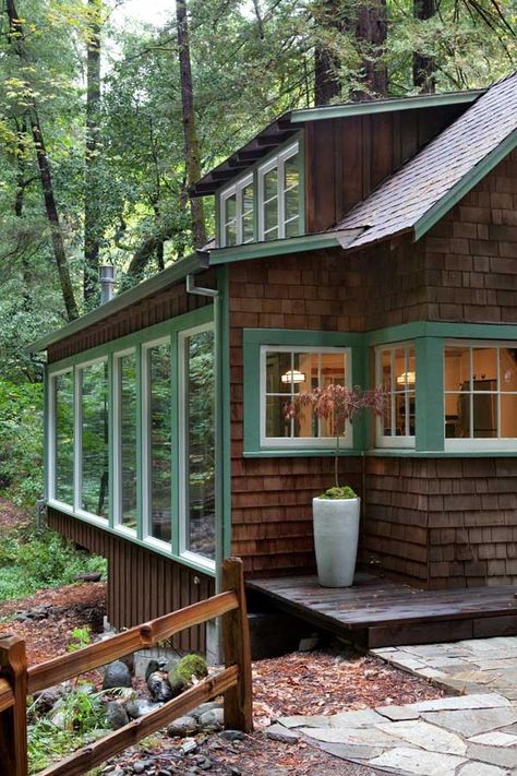 Above a babbling creek, a vintage weekend cabin in northern California got modernized without sacrificing period details. How? Sonoma-based architect Amy Alper, a member of the Remodelista Architect and Designer Directory, essentially wrapped the old building in a new, light-filled shell to take advantage of the Calistoga property’s spectacular views: Planning a rustic weekend getaway? … Forest Window, Exterior Siding Colors, Wood Siding Exterior, Trendy House, Wooden Cabin, House Lake, Cabin Exterior, Window Ideas, Windows Exterior