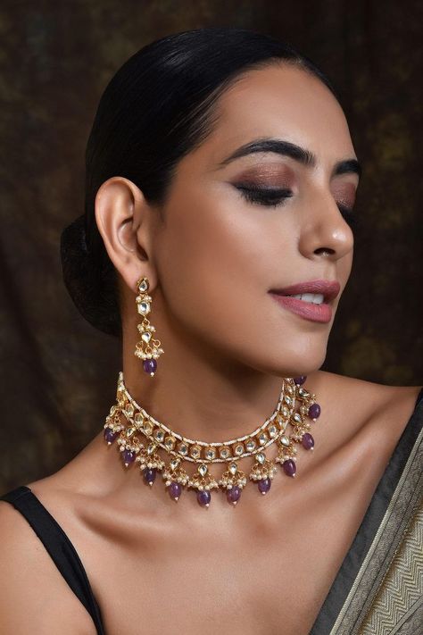 Buy #gold toned #choker with hexagon motifs encrusted with #kundans & purple #stone drops at #AzaFashions Shop online now at #Azafashions.com Call +12132135273 or email contactus@azafashions.com for enquiries. #wedding #festive #ethnic #tradional #shopping #shoponline #party #reception #jewellery #accessories Reception Jewellery, Tassel Jewelry Diy, Purple Jewelry Set, Studded Choker, Purple Choker, Choker Jewellery, Gold Temple Jewellery, Kundan Jewellery Set, Choker Necklace Designs