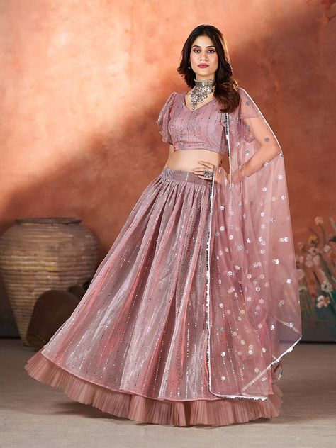 Make a statement with Shop Garb's Mauve Pink Sequins Embroidered Lehenga Choli. This ensemble exudes elegance with its unique embroidery and sequin work, perfect for weddings and ceremonial occasions. The circular net lehenga in mauve pink is complemented by a matching net blouse adorned with intricate embroidery. Complete the look with the solid bordered net dupatta for a touch of sophistication." Pink Sequin Lehenga, Sequins Lehenga Choli, Sequin Lehenga, Wedding Lehenga Choli, Sequin Material, Net Blouses, Net Lehenga, Pink Lehenga, Embroidered Lehenga