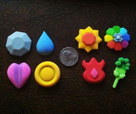 With the Pokemon gym badges by your side, you'll finally receive the recognition you deserve for having wasted spent endless hours playing Pokemon on your Game... Pokemon Gym Badges, Clay Pokemon, Gym Badges, Pokemon Badges, Crea Fimo, Pokemon Gym, Pokemon Diy, Paper Quilling Jewelry, Pokemon Craft