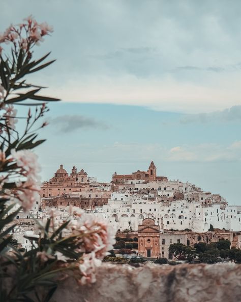 Another place to add to your Italy bucket list ☀️ 📍 Ostuni, Puglia Ostuni is often referred to as “La Città Bianca” or “The White City” 🤍 Known for its striking whitewashed buildings, Ostuni is perched on a hilltop and offers stunning views of the surrounding olive groves and out to the the Adriatic Sea. We came here on the one gloomy day we had in Italy, and I knew I’d regret saying it but it was a nice break from the heat at the time 😂 oh how I wish I was back in that heat now… — Su... Basilicata Italy, Ostuni Puglia, Italy Bucket List, How I Wish, Travel Moments, I Wish I Was, Beautiful Cities, Puglia Italy, Gloomy Day