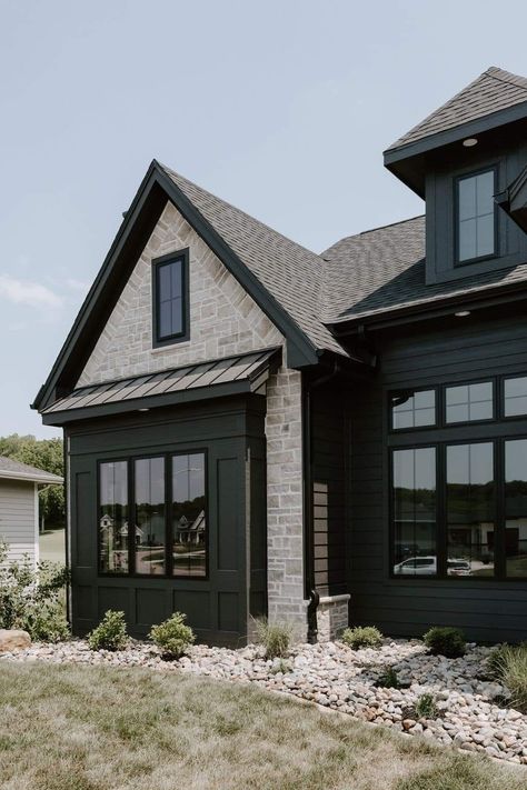 Black House With Light Stone, Black Board And Batten Exterior With Brick, Black And Rock House Exterior, Charcoal And Brick Exterior, Black House Light Stone, Black Metal Exterior House, Big Windows Front Of House, Black Siding With Stone, Dark Grey Siding Black Windows