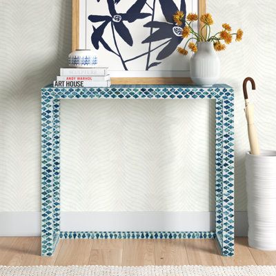 Greet guests in your entryway with this elegant and breezy console table. It showcases a beachy capiz shell inlay in soft, neutral hues for an artisanal vibe that's sure to complement your coastal space. The 35" wide frame is made from engineered wood, and it rests on a sled base for an open feel that keeps sightlines clear. We love that the surface accommodates everything from accent pieces and a vase of fresh flowers to a table lamp and a mail organizer. Plus, this table offers a lot of room u Living Room Side Table Decor Ideas, Console Table Modern Luxury, Entryway Table, Minimalist Entryway, Small Entryway Table, Entrance Console, Console Table Modern, White Console Table, Capiz Shell