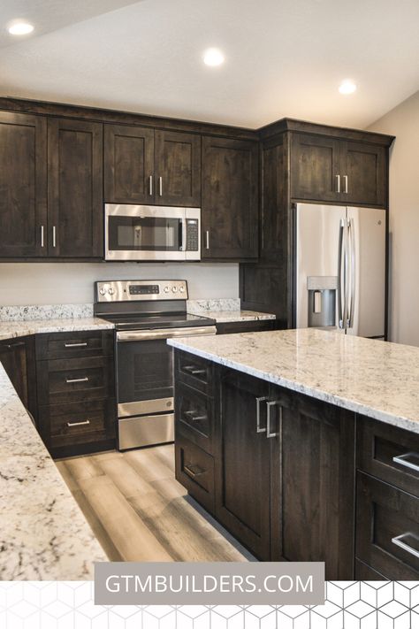 Wow!! I love the dark shaker cabinets with the light grey granite countertops. It's such a beautiful contrast!  #kitchen #kitchendesign #inspiration #interiordesign #floorplans #twostory #2story #darkcabinets #dreamkitchen #kitchenideas #traditional #timeless #openconcept Flooring With Dark Cabinets Kitchen, Dark Stained Kitchen Cabinets, Obx House, Dream Kitchen Ideas, Kitchen Remodel Dark Cabinets, Dark Brown Cabinets, Brown Kitchen Cabinets, Kitchen Design Inspiration, Kitchen Cabinets And Countertops