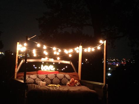 Had a romantic birthday date night with a view of the city. Hubby made the stakes that went into the bed of the truck. Truck Bed Date Projector, Pickup Bed Date Night, Truck Bed Camping Romantic Date Ideas, Truck Bed Date Ideas, Backyard Date Night Ideas Romantic, Back Of Truck Date Night, Truck Bed Camping Diy, Pickup Truck Date, Truck Bed Date Night