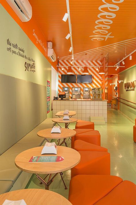 Restaurant Orange Design, Front Restaurant Design, White Restaurant Interior Design, Yellow Cafe Interior, Purple Restaurant, Yellow Restaurant, Juice Bar Interior, Orange Cafe, Food Court Design