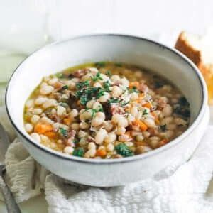 Learn how to make this delicious simple to prepare ham and bean soup using leftover ham. It’s loaded with flavor and can be cooked on the cook top, in an instant pot, or in a crock pot. Don’t miss out on this comforting soup recipe. #soup #ham #recipes Soup Ham, Ham And Lentil Soup, Easy Tomato Soup Recipe, Ham And Bean, Chef Billy Parisi, Billy Parisi, Cacciatore Recipes, Chicken Cacciatore Recipe, Recipe Soup