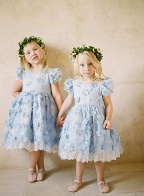 The color blue is becoming a very trendy wedding color. Click to see these blue wedding trends for your wedding planning. From blue wedding rings, to colored wedding dresses and blue bridesmaid dresses to beautiful wedding cakes. #Wedding #WeddingColors #BlueWeddingColors #Blue #BlueTrends #WeddingTrends #WeddingDetails #WeddingPlanning | Martha Stewart Weddings Tea Length Flower Girl Dress, Blue Flower Girl, Flower Girl Dresses Blue, Something Blue Wedding, Linnet, Flower Girls, Something Blue, Blue Flower, Girl Dresses