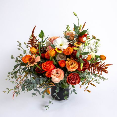 This lush arrangement is beautifully crafted in a mate black vase to create a breathtaking statement piece. Measuring 24” tall and 18” wide, Fall'ing Medium Arrangement is the perfect addition to any home. Fall Dried Flowers Floral Arrangements, Early Fall Floral Arrangements, Floor Alter Flowers, Whimsical Fall Floral Arrangements, Mexican Themed Flower Arrangements, Southwest Floral Arrangements, Large Fall Flower Arrangements, Simple Fall Floral Arrangements, Artistic Flower Arrangements