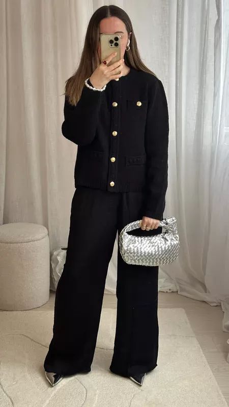 Silver accessories with an all black outfit… such a great classic combo 🖤🪩 Black boucle cardigan | Bottega bag dupe | Designer dupes | Silver bag | Silver shoes | Silk wide legged trousers | Christmas Day outfit ideas #LTKworkwear #LTKSeasonal #LTKparties Silver Bag Outfit Ideas, Silver Bag Outfit, Black Pants Work Outfit, Wide Legged Trousers, Bottega Bag, Day Outfit Ideas, Silver Bag, Christmas Day Outfit, Trouser Outfit