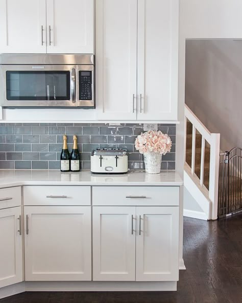 Metallic gray backsplash. Metallic backsplash kitchen color combos. Gray subway tile kitchen quartz counter. White cabinets white countertops modern. Kitchen counter decor ideas simple. Microwave cabinet built in. Outlet placement on backsplash. Kitchen backsplash ideas white cabinets. #kitchen #backsplash #kitchendecor #kitchendesign Grey Subway Tile Kitchen, Kitchen Color Combos, Gray Kitchen Backsplash, Backsplash Kitchen White Cabinets, White Cabinets White Countertops, Backsplash With White Cabinets, Kitchen Counter Decor, Kitchen Cabinets Decor, Classic Kitchen