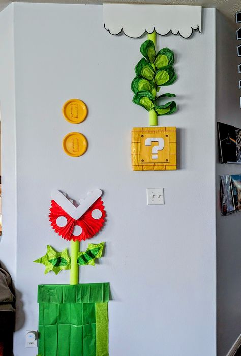 Themed party decor. Made with paper plates, pool noodle, poster board, and tissue paper Noodle Poster, Mario And Princess Peach, Super Mario Party, Video Game Party, Pool Noodle, Mario Bros., Classroom Theme, Mario Party, Classroom Design