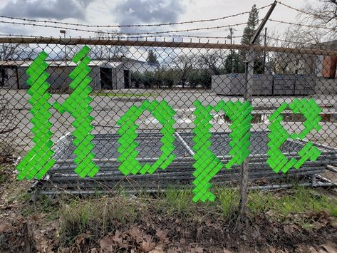 Each Mind Matters Fence Art Installation Playground Fence, Fence Weaving, Health Campaign, Hearts Paper Crafts, Lime Green Ribbon, Fence Art, Street Marketing, Chain Link Fence, Library Decor