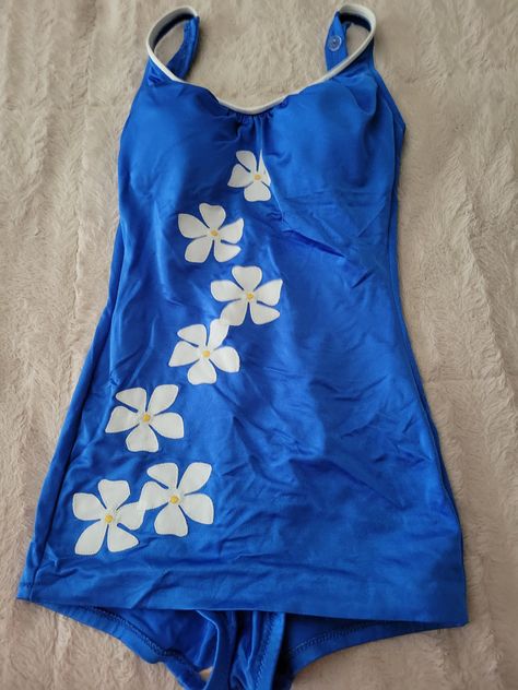 This is a very nice 1960 Blue swim suit with white daisy along the front. In very good vintage condition.  It is a very shapely bathing suit. Has adjustable buttons on strap.  Tag says size 12 however, this is in the 1960 and todays size would be a size 6.  It has a good tight stretch to it.   Any other questions please feel free to ask.  Thanks for stopping by 1970s Bathing Suits, Swim Tops For Large Bust, Early 2000s Swimsuit, Full Body Bathing Suit, 2000s Swimsuit, White Swimsuit Outfit, One Piece Swimsuit Aesthetic, Swimsuits Aesthetic, Swimsuit Y2k