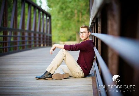 Senior boy on bridge Bridge Photoshoot Photo Ideas Men, Bridge Portrait Photography, Bridge Senior Pictures Boy, Senior Photos On Bridge, Boy Fall Senior Picture Ideas, Downtown Senior Photos Boy, Senior Pics Boys, Bridge Senior Pictures, Boy Senior Portraits