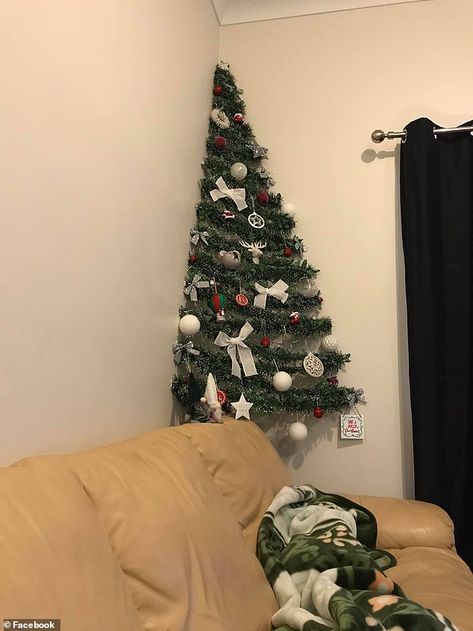 An Australian mum who couldn't spare the space for a traditional Christmas tree in her small apartment has created an eye-catching two-dimensional replacement. How To Make A Small Christmas Tree, Christmas Trees For Small Spaces, Corner Wall Christmas Tree, Christmas Tree Small Space, Christmas Tree In Small Living Room, Tiny Christmas Tree Ideas, Christmas Tree For Small Spaces, Space Saving Christmas Tree, Alternative Christmas Tree Diy