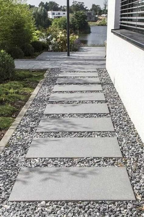 The concrete stepping blocks leading to the house always looks appealing. The straight pathway with pebbles is easy to maintain. Sidewalk Landscaping, Pavers Backyard, Walkway Landscaping, Side Yard Landscaping, Walkway Design, Pathway Landscaping, Garden Stepping Stones, Gravel Garden, Stone Walkway