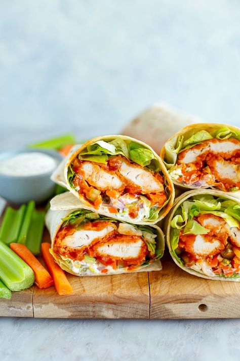 This is truly the BEST Buffalo Chicken Wrap you'll ever eat, with the crispiest baked chicken tenders coated in sauce. It's my fave lunch! Rotisserie Chicken Wrap Ideas, Healthy Buffalo Chicken Wraps For Lunch, Best Buffalo Chicken Wraps, Crunchy Chicken Wraps, Grilled Chicken Wrap Recipes Healthy, Buffalo Wraps Chicken, Crispy Chicken Ranch Wraps, Chicken Wrap Sandwiches, Chicken Tender Wraps Recipes