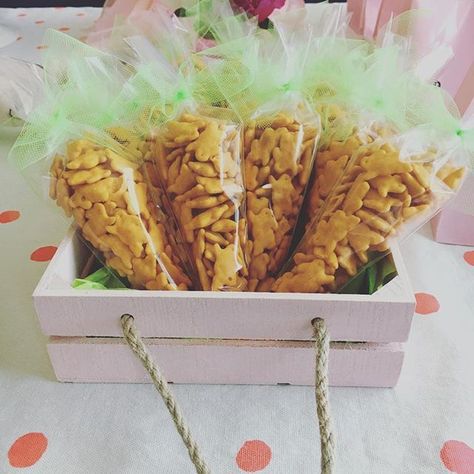 Cheddar bunny party favors from the "Some Bunny is One" birthday party.  Organic cheddar bunnies in cone shaped plastic bags tied with ribbon.  So easy and cheap.  #firstbirthday #somebunnyisone #confettiandwishes #eventplanning #eventplanner #eventstyling #eventprofsuk #eventprofs #meetingplanner #meetingplanner #meetingprofs #inspiration #popular #trending #eventplanning #eventdesign #eventplanners #eventdecor #eventstyling #micefx #meeting #planners #international [Visit www.micefx.com fo... Bunny Theme Party Favors, Some Bunny Is One Party Favors, Bunny Centerpieces Birthday Parties, Bunny Birthday Party Favors, Some Bunny Is One Birthday Party Ideas, Somebunny Is One Birthday, Somebunny Is Turning One, Bunny Party Favors, Some Bunny Is 1