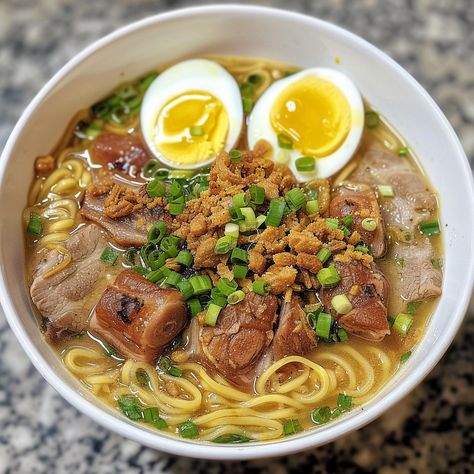 🍜✨ Experience the savory goodness of Batchoy, a classic Filipino noodle soup! #Batchoy #FilipinoFood Batchoy Ingredients: Pork belly (1 lb, sliced) Pork liver (0.5 lb, sliced) Egg noodles (4 cups, cooked) Garlic (4 cloves, minced) Onion (1, chopped) Shrimp paste (2 tbsp) Fish sauce (3 tbsp) Pork broth (6 cups) Chicharron (1 cup, crushed) Green onions (for garnish) Hard-boiled eggs (2, halved) Instructions: In a pot, sauté garlic and onion until fragrant. Add pork belly and liver, cook unt... Batchoy Recipe Filipino Food, Bo Kho Recipe, Filipino Noodles, Pork Liver, Food Reference, Pork Broth, Filipino Foods, Instagram Recipes, Twisted Recipes