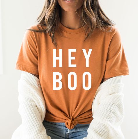 Hey Boo Tshirt, Fall, Autumn, Halloween, fun halloween shirt, trendy halloween, cute halloween, family matching halloween, fall tshirt -----ABOUT OUR TEES----- Our tees fit like a well-loved favorite, featuring a crew neck, short sleeves and designed with superior Airlume combed and ring-spun cotton that acts as the best blank canvas for printing. Key Features: - Heat transfer vinyl print - Retail fit - Side seamed - Shoulder taping - Fitted at bicep - Tear-away label - Unisex, women, youth sizi Fall Tshirt Designs, Fall Tshirt, Hey Boo, Halloween Family, Matching Halloween, Cute Shirt Designs, Autumn T Shirts, Autumn Halloween, Halloween Cute