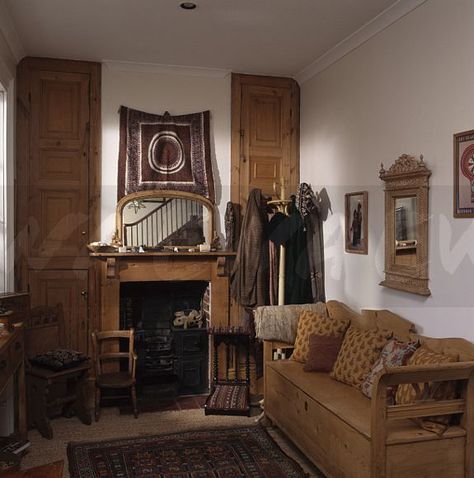 Patterned cushions on old pine settle in small living room with tapestry and Victorian mirror above pine fireplace Room With Tapestry, Patterned Cushions, Victorian Mirror, Room Tapestry, Vintage Farm, Cushion Pattern, Small Living Room, Small Living, Fireplace